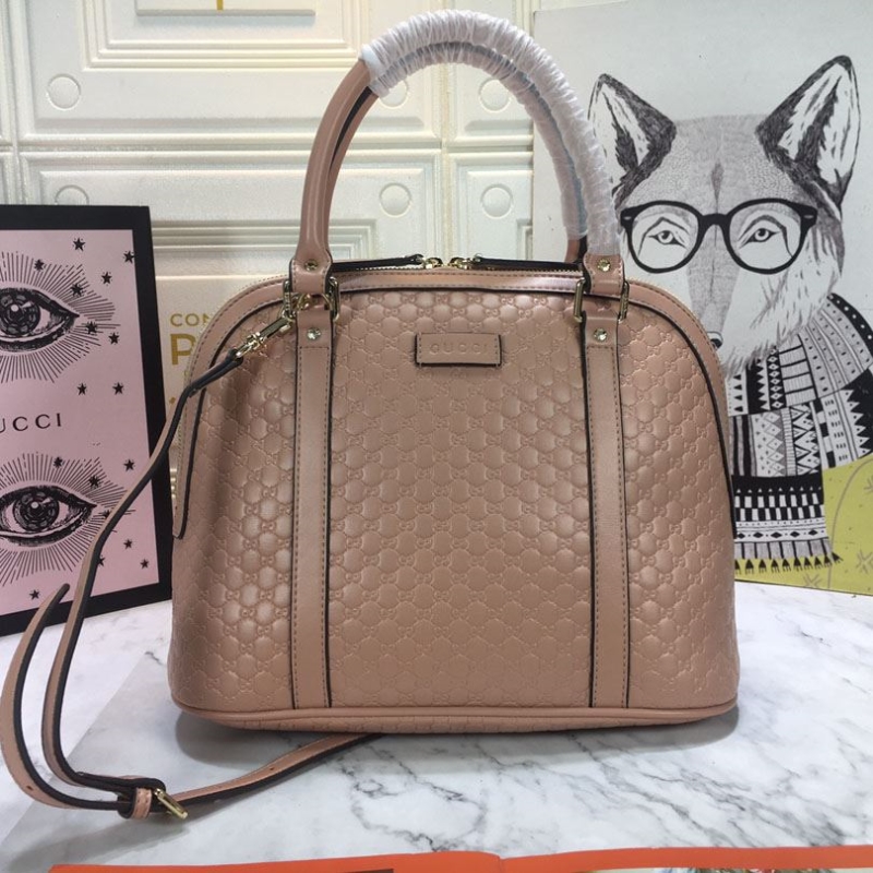 G*u*i top handle bags